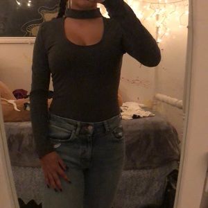 Grey body suit with cutout chest. Never worn.